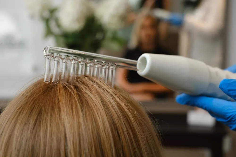 Trichologist examining clients hair in Clinic near Manchester